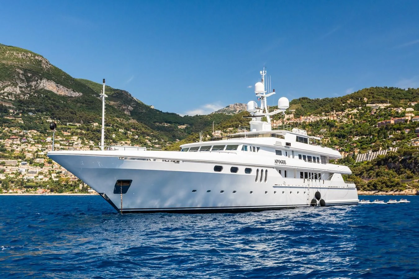 a white yacht in the water aboard APOGEE Yacht for Sale