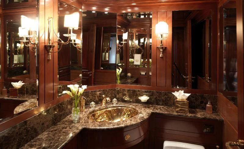 a bathroom with a sink and a mirror aboard APOGEE Yacht for Sale