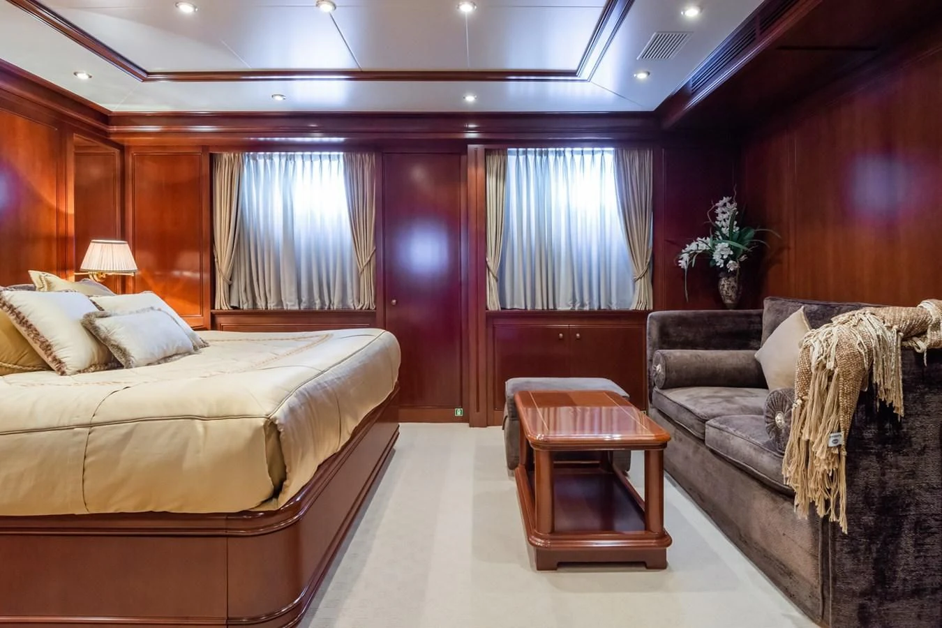 a hotel room with a bed and a chair aboard APOGEE Yacht for Sale