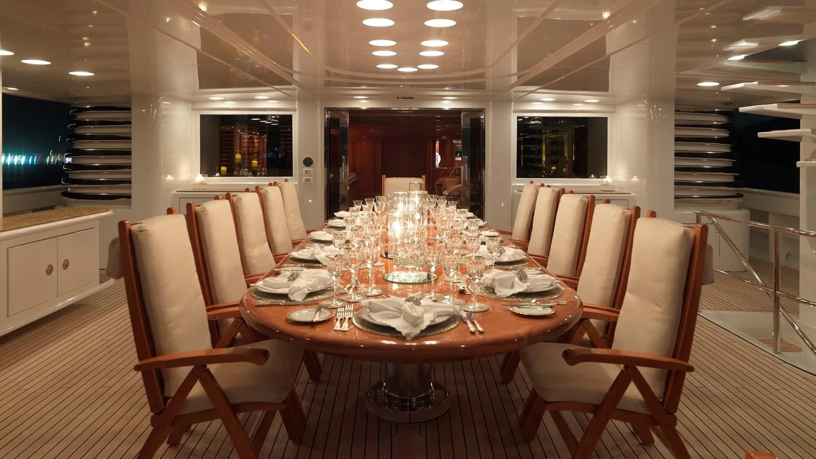 a dining room with a table set aboard APOGEE Yacht for Sale