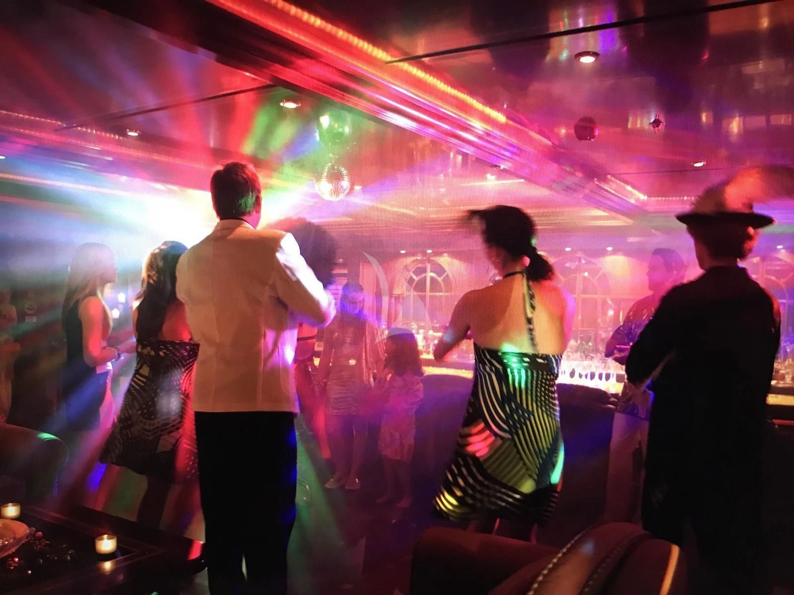a group of people dancing aboard APOGEE Yacht for Sale