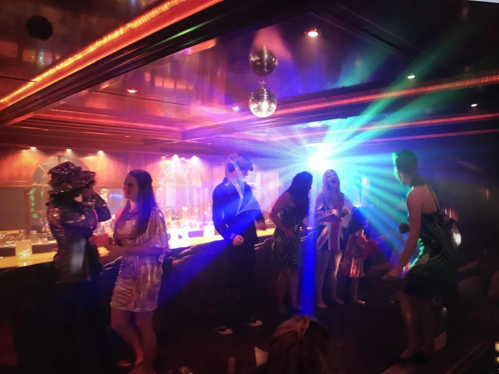 a group of people dancing aboard APOGEE Yacht for Sale