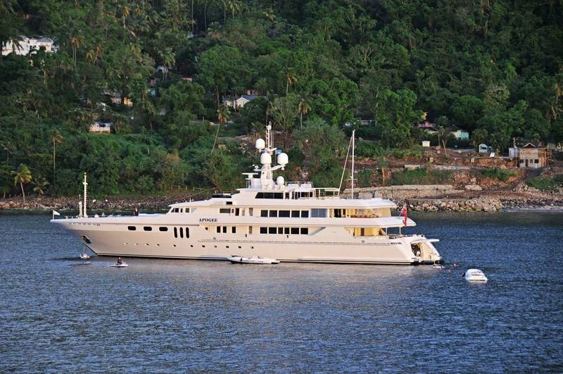 a large white boat in the water aboard APOGEE Yacht for Sale