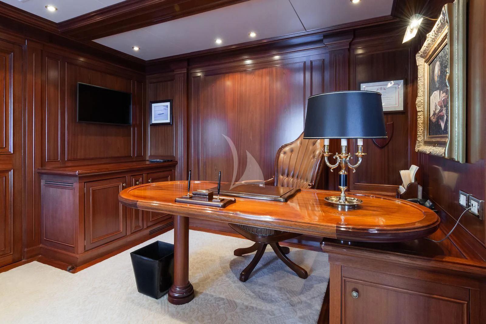 a room with a table and a lamp aboard APOGEE Yacht for Sale