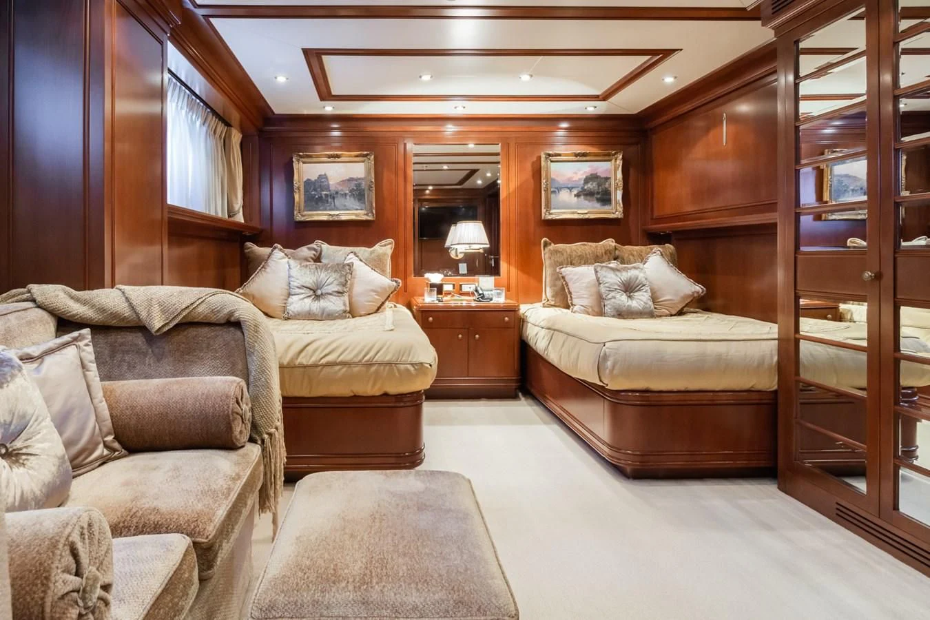 a living room with a bed and a couch aboard APOGEE Yacht for Sale