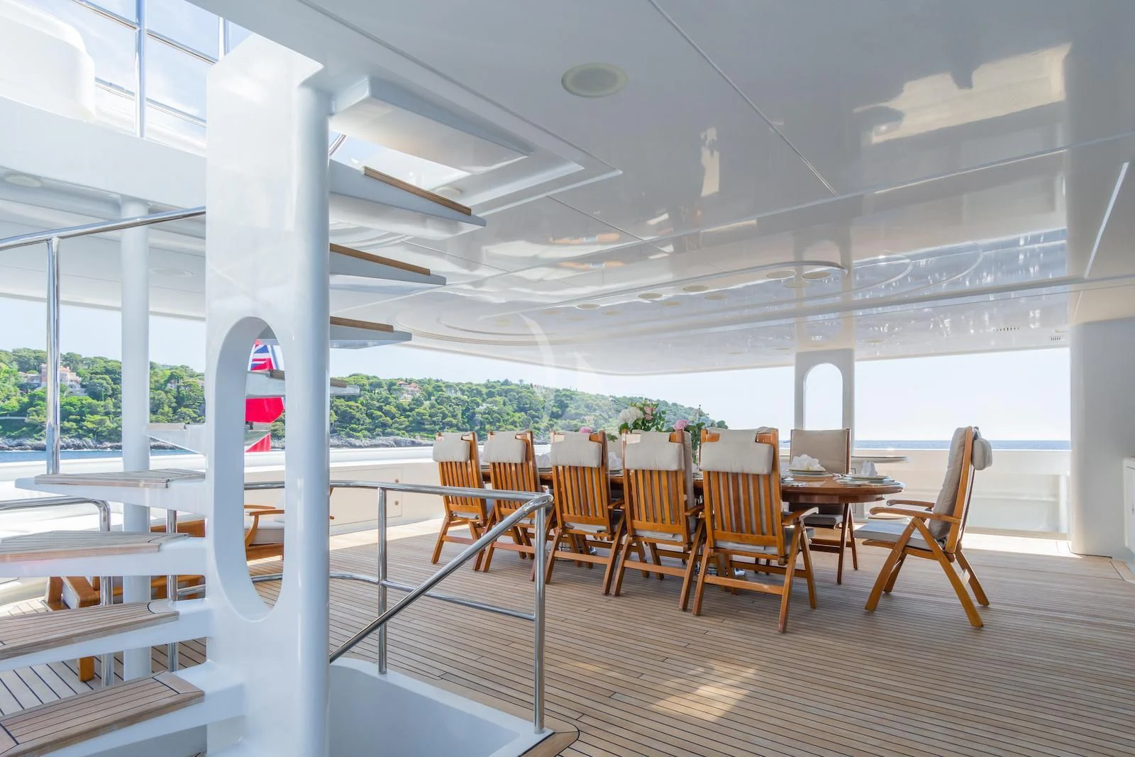 a room with tables and chairs aboard APOGEE Yacht for Sale