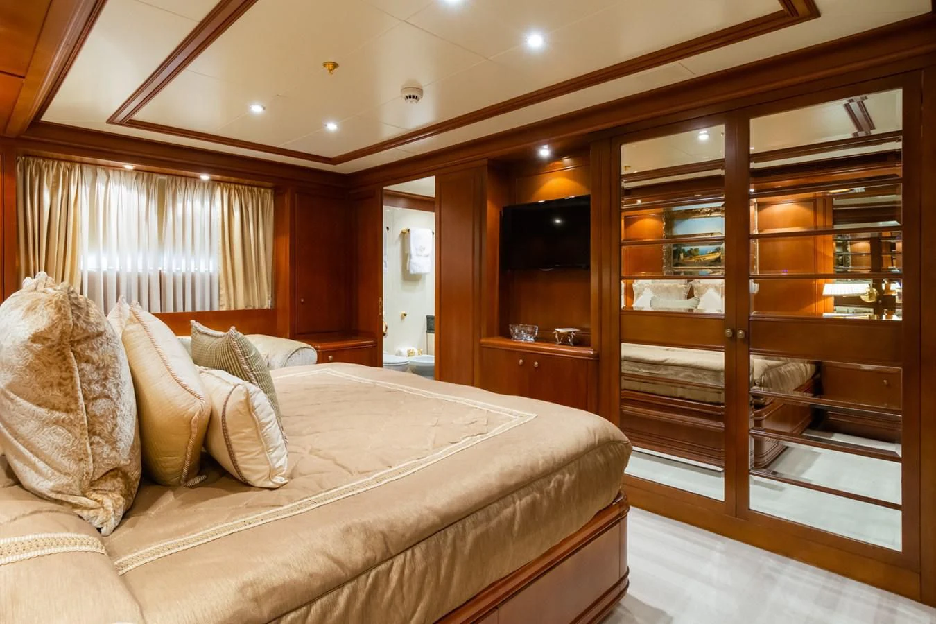 a bed in a room aboard APOGEE Yacht for Sale