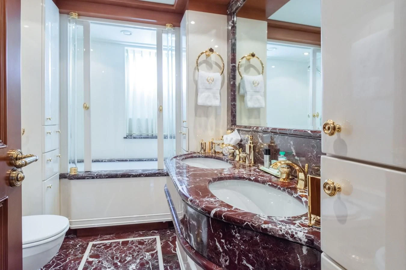 a bathroom with a sink and a bathtub aboard APOGEE Yacht for Sale