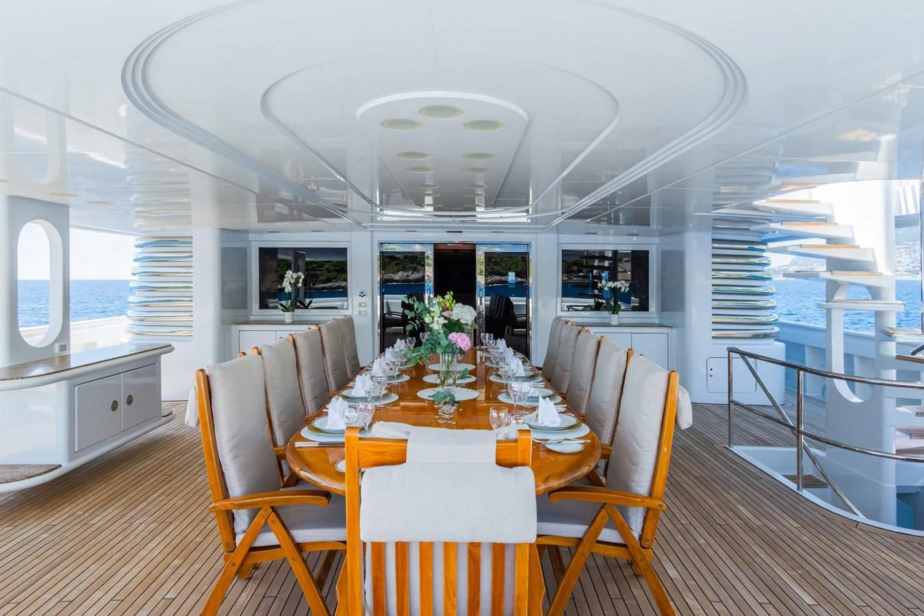 a dining room with a table and chairs aboard APOGEE Yacht for Sale
