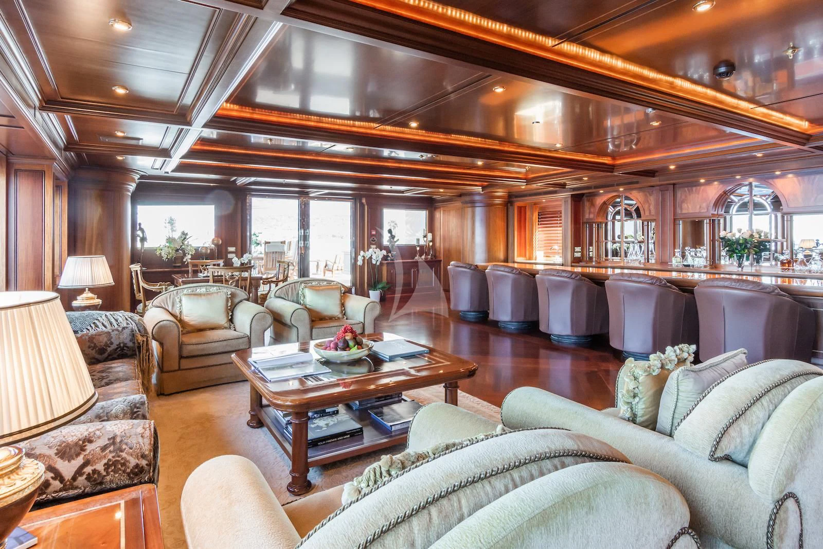 a living room with a large wood ceiling aboard APOGEE Yacht for Sale