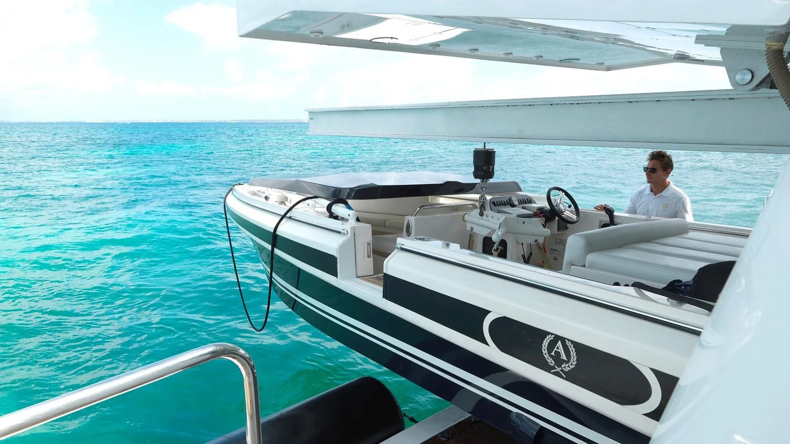 a person sitting on a boat aboard APOGEE Yacht for Sale