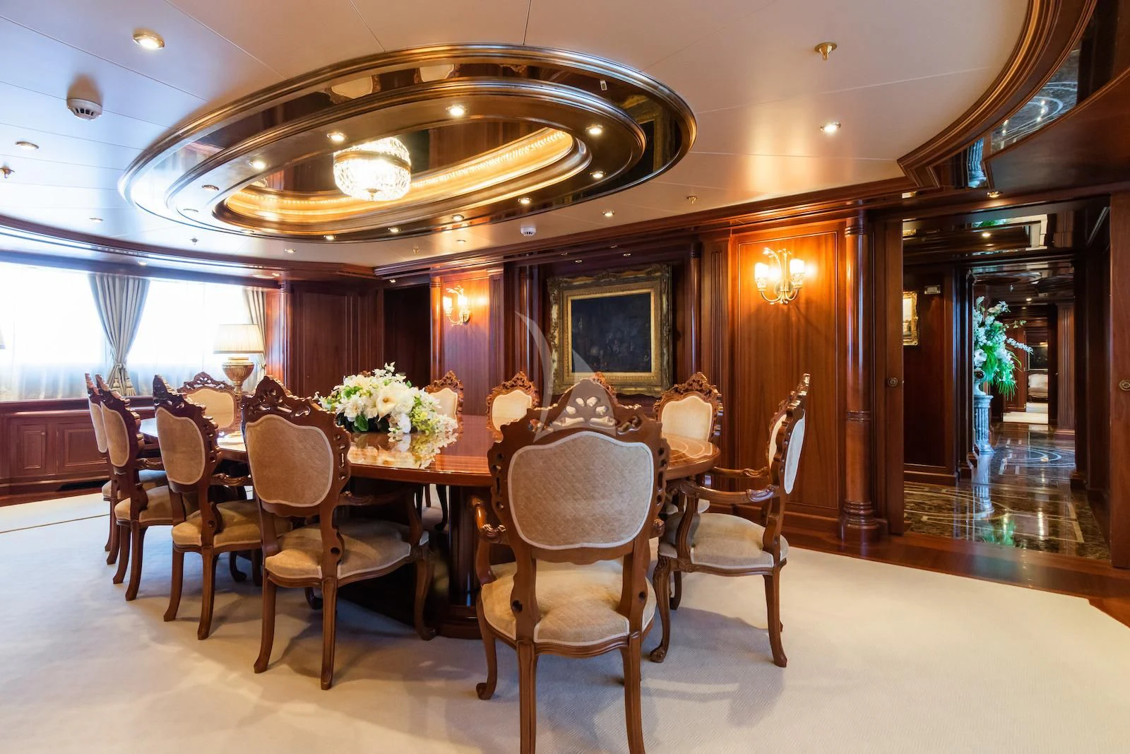 a dining room with a table and chairs aboard APOGEE Yacht for Sale