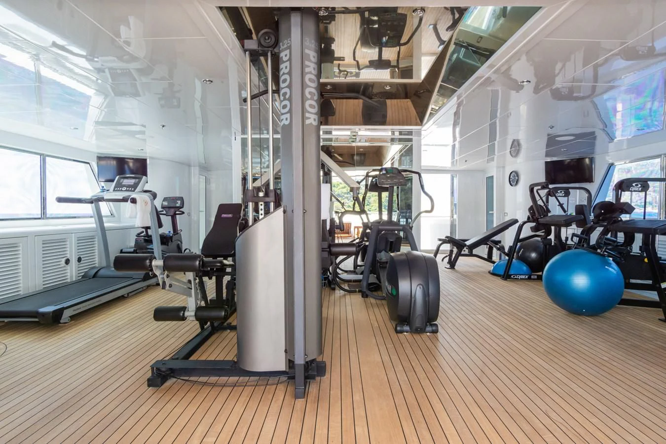a room with exercise equipment aboard APOGEE Yacht for Sale