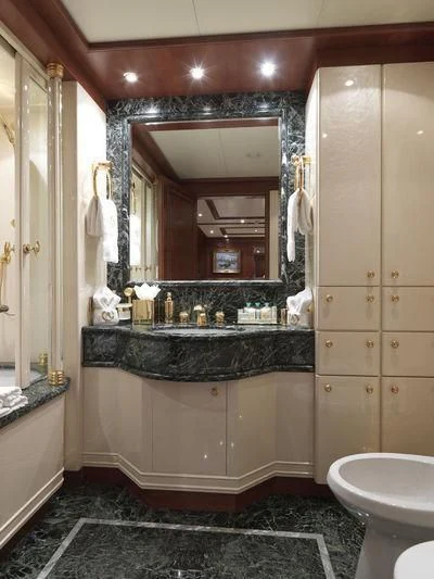 a bathroom with a large mirror aboard APOGEE Yacht for Sale
