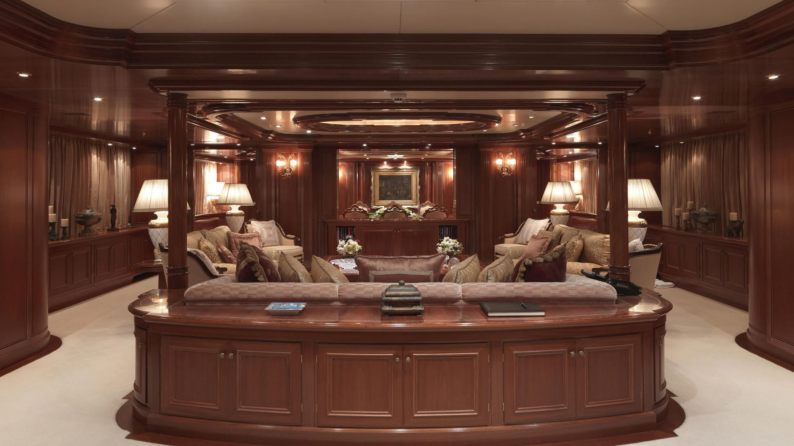 a large living room with a large mirror aboard APOGEE Yacht for Sale