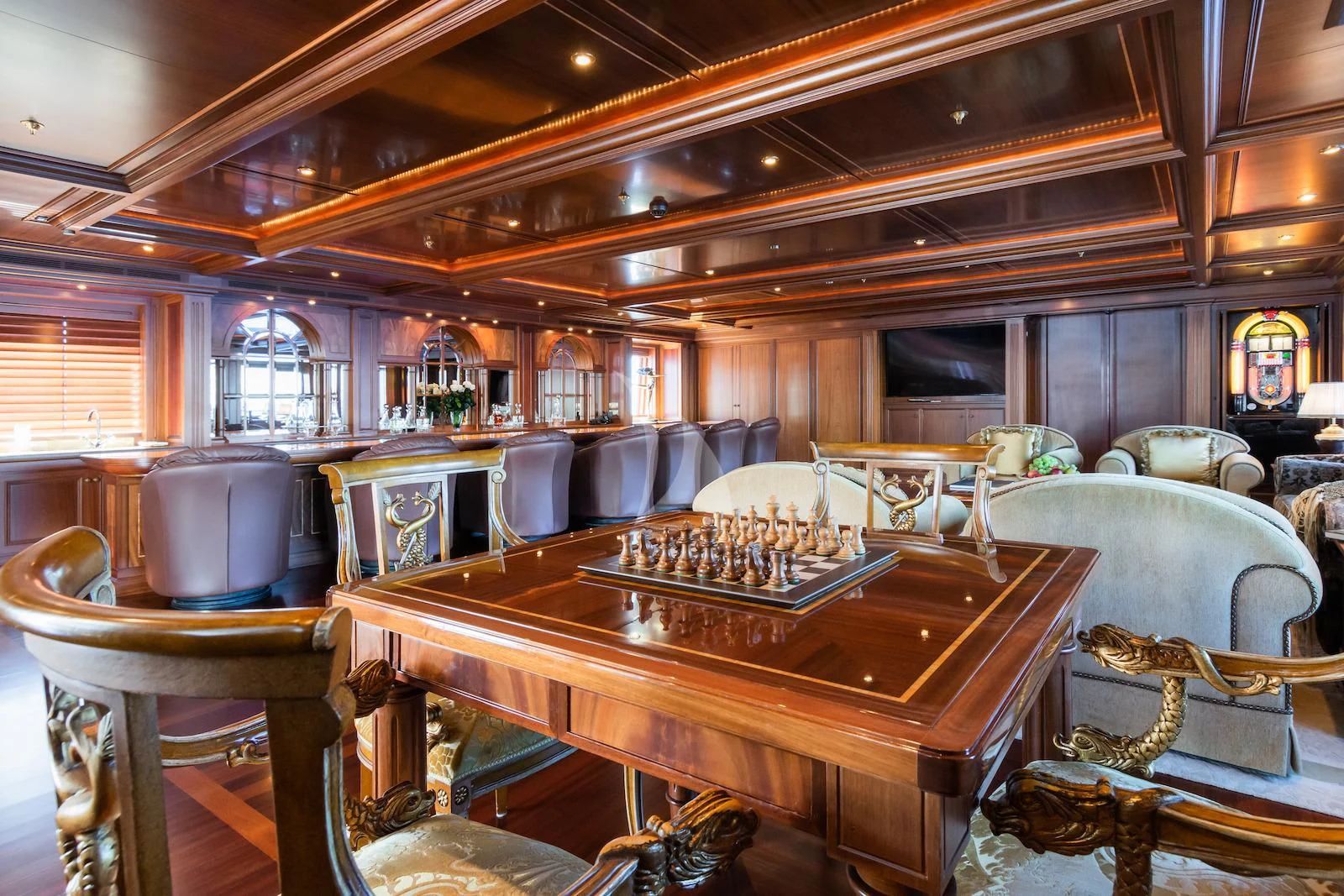 a room with a table and chairs aboard APOGEE Yacht for Sale