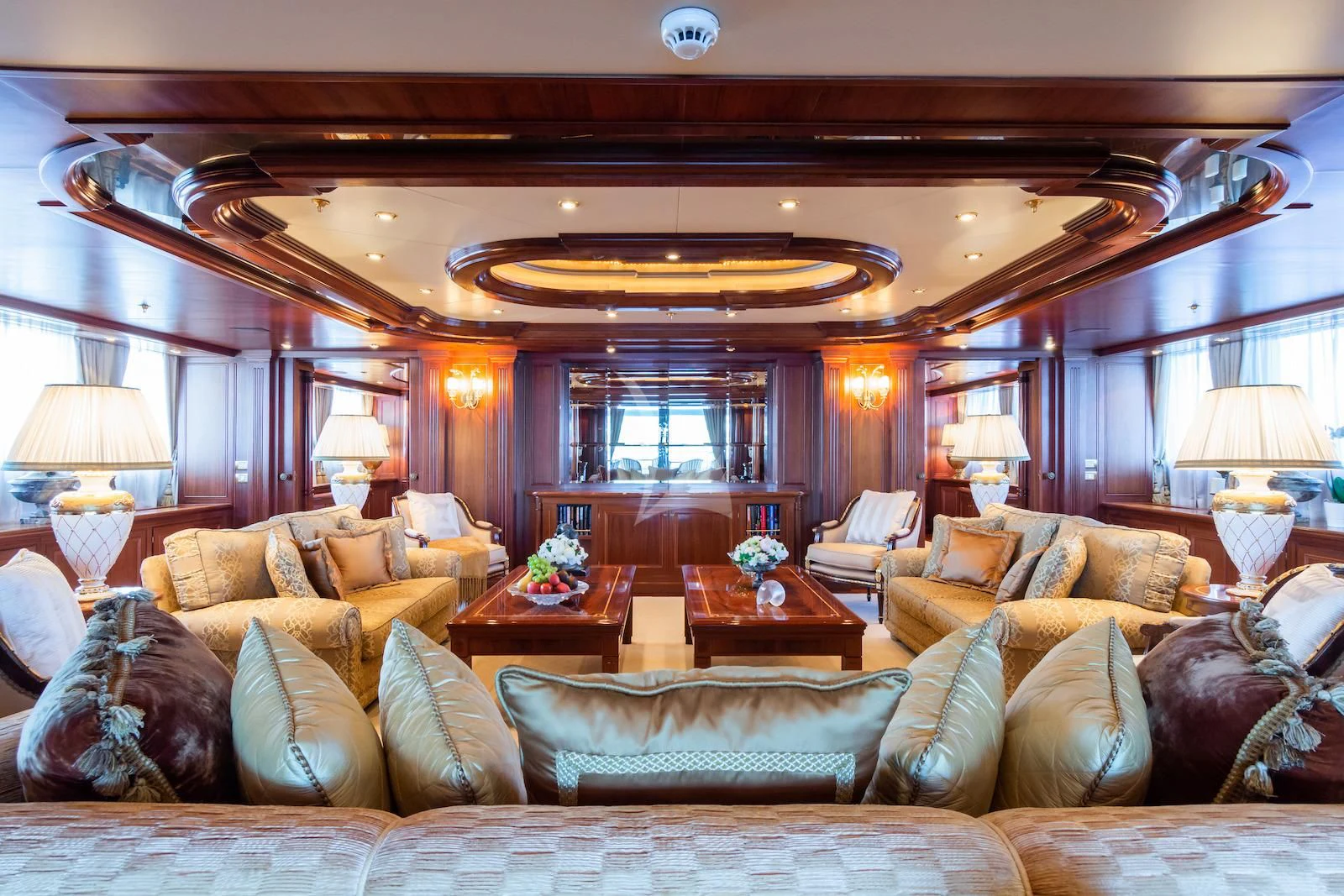 a living room with a large couch and a large window aboard APOGEE Yacht for Sale