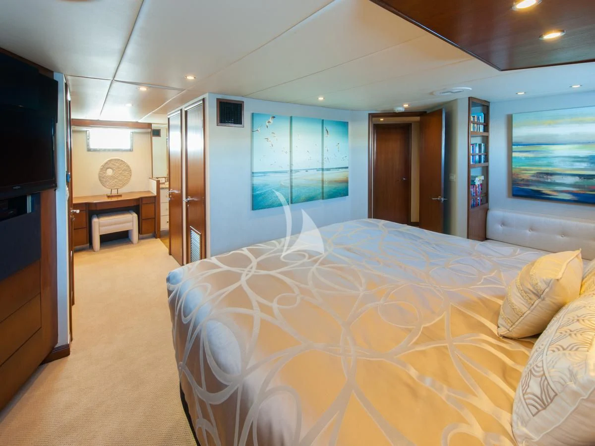 a bedroom with a large bed aboard SERENITY Yacht for Charter