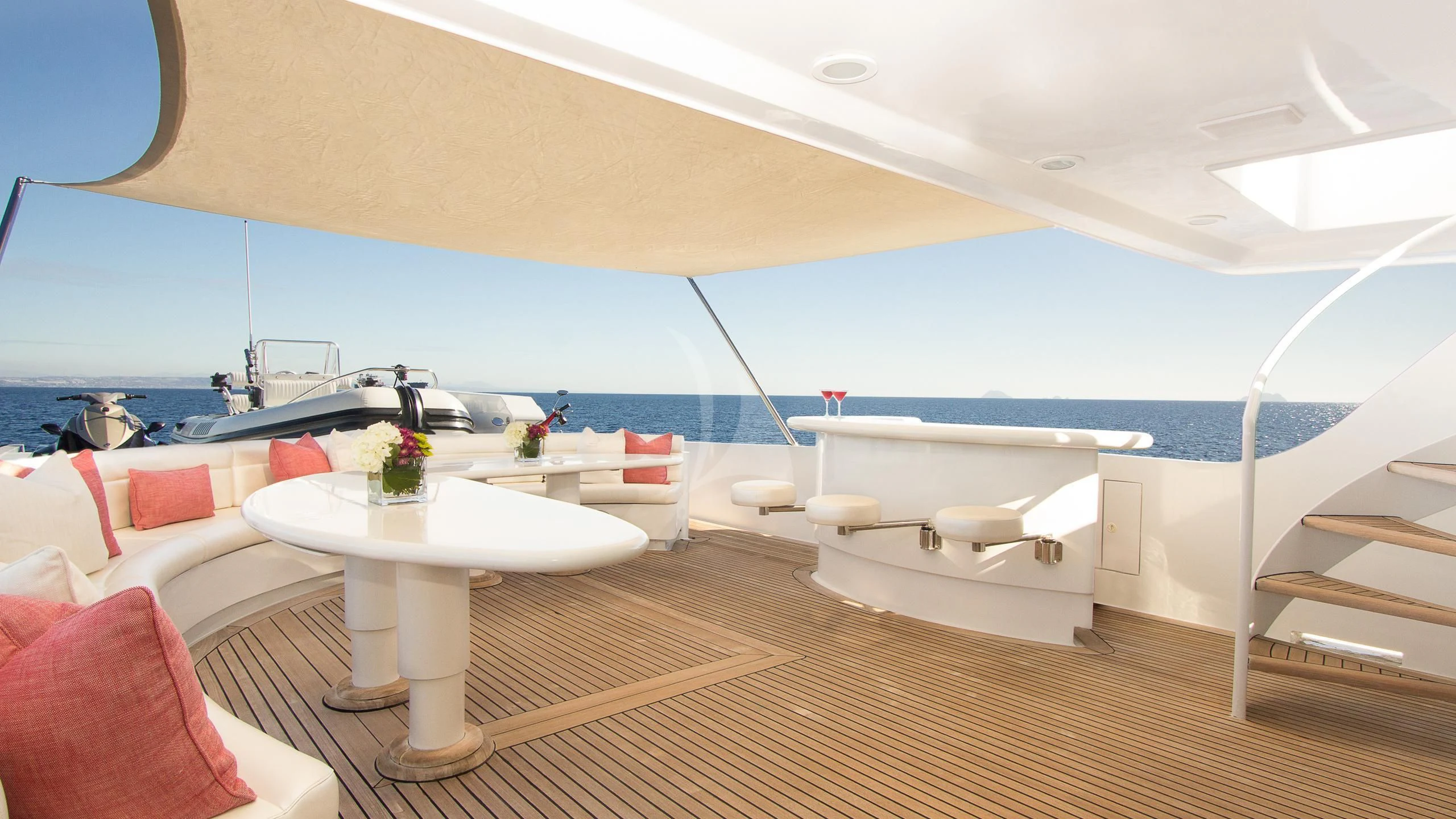 a room with a large tub and a table with a sink aboard SERENITY Yacht for Charter