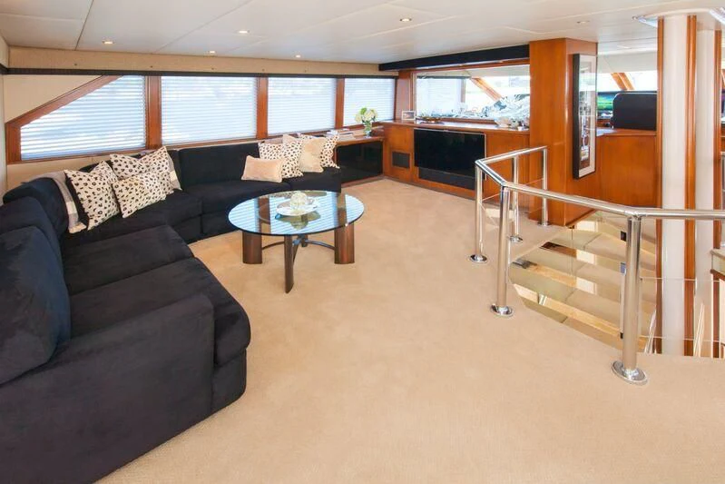 a living room with a large window aboard SERENITY Yacht for Charter