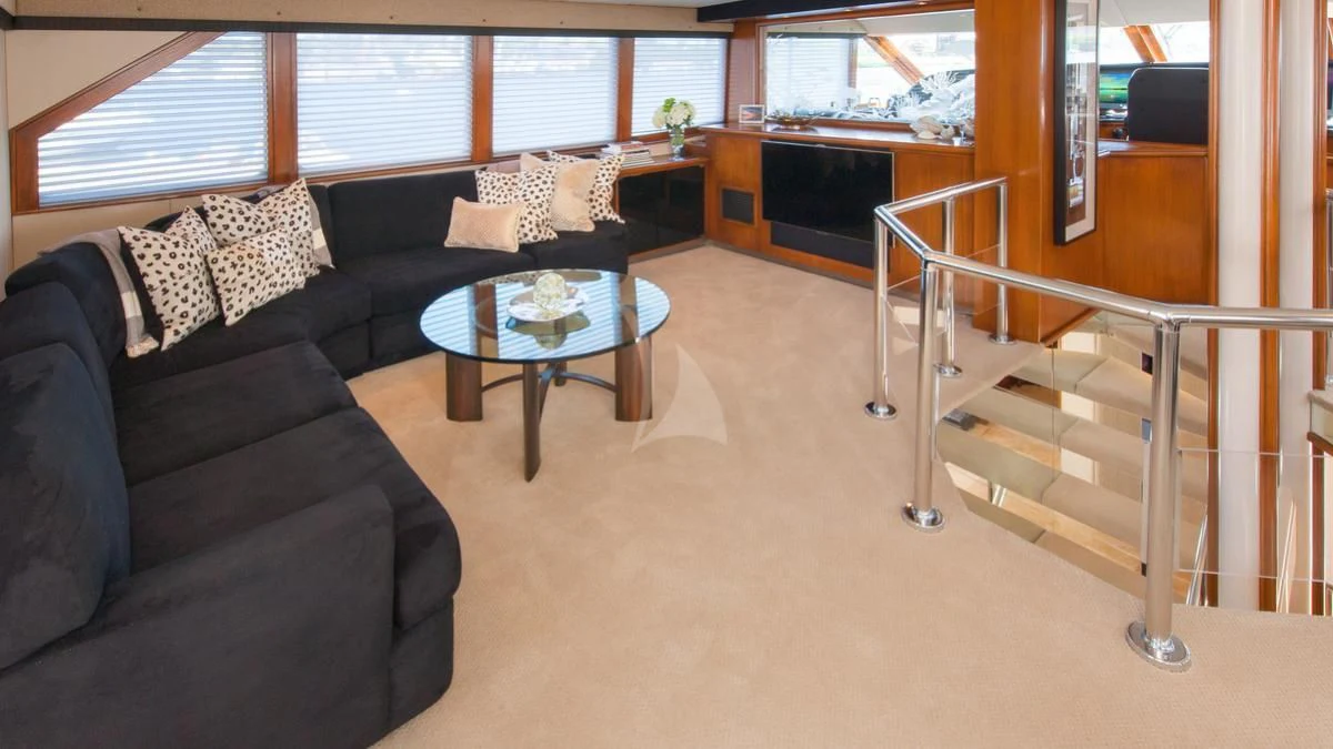 a living room with a couch and a table aboard SERENITY Yacht for Charter