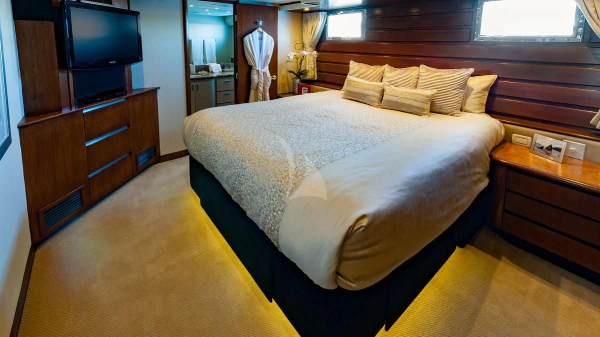 a bed in a room aboard SERENITY Yacht for Charter