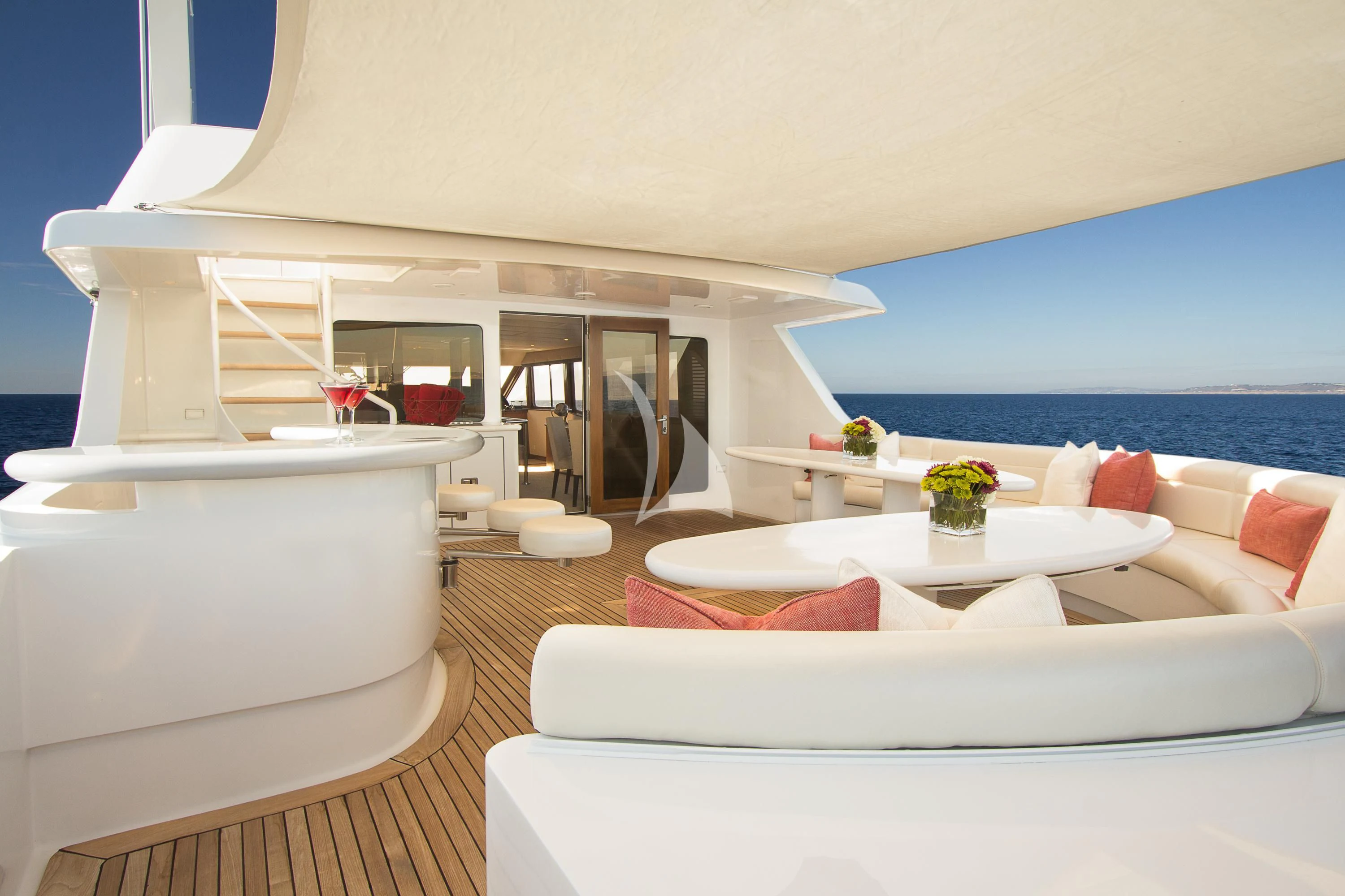 a living room with a large balcony aboard SERENITY Yacht for Charter