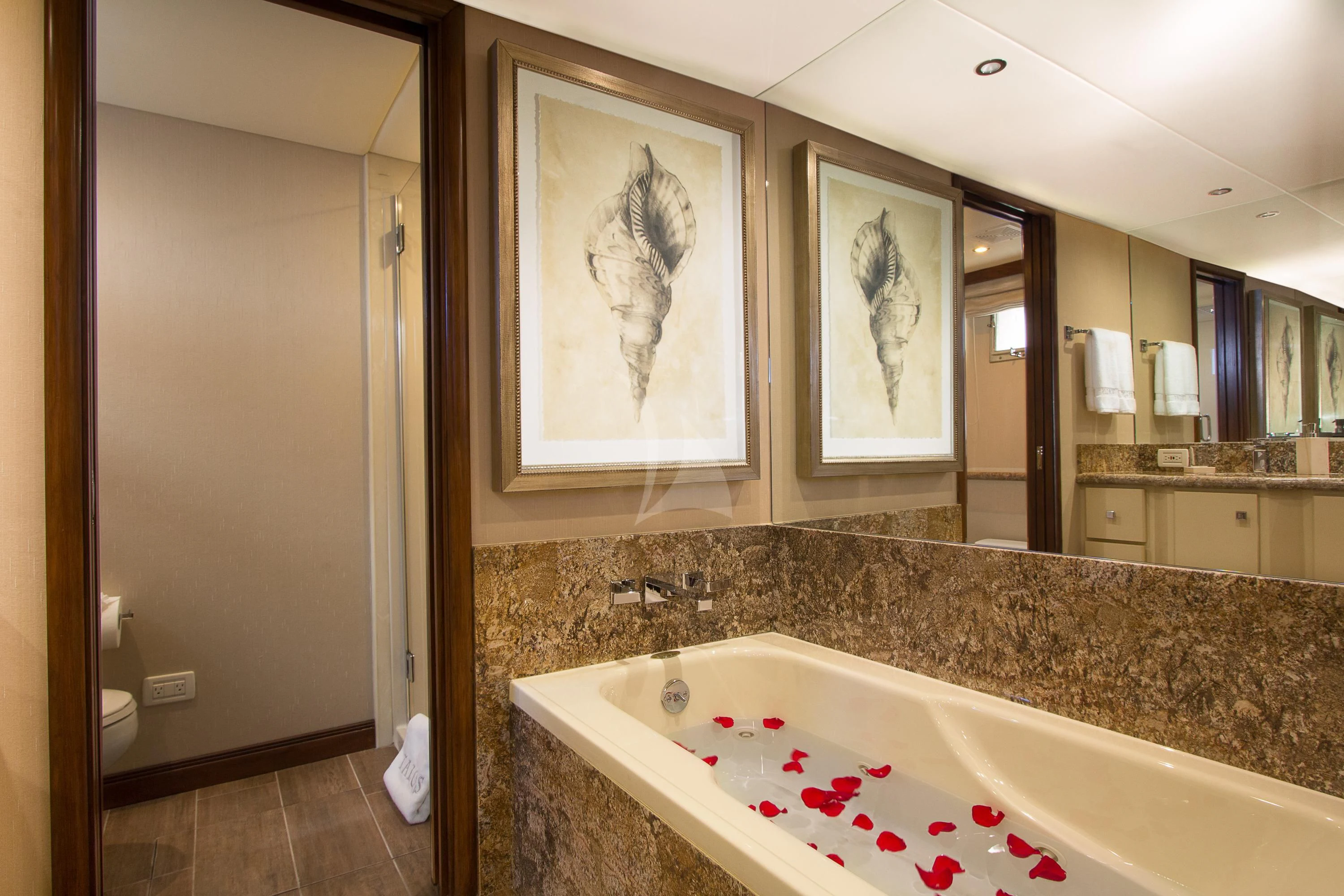 a bathroom with a large bathtub aboard SERENITY Yacht for Charter