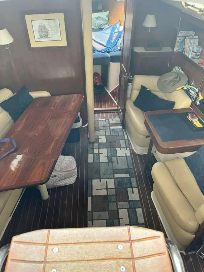a room with a table and chairs aboard SERENITY Yacht for Charter