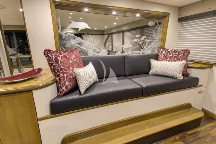a couch with pillows aboard SERENITY Yacht for Charter