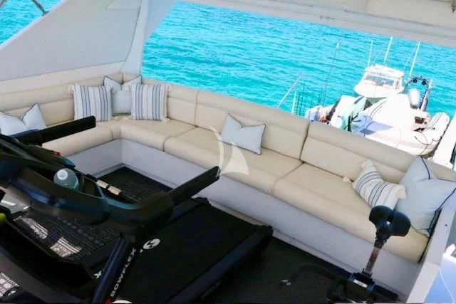 a room with a pool table and a couch aboard SERENITY Yacht for Charter