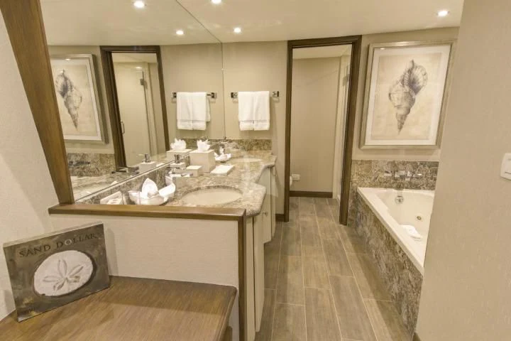 a bathroom with a large mirror aboard SERENITY Yacht for Charter