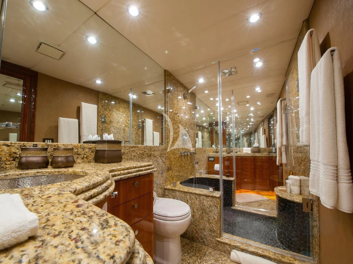 a bathroom with marble counters aboard SERENITY Yacht for Charter