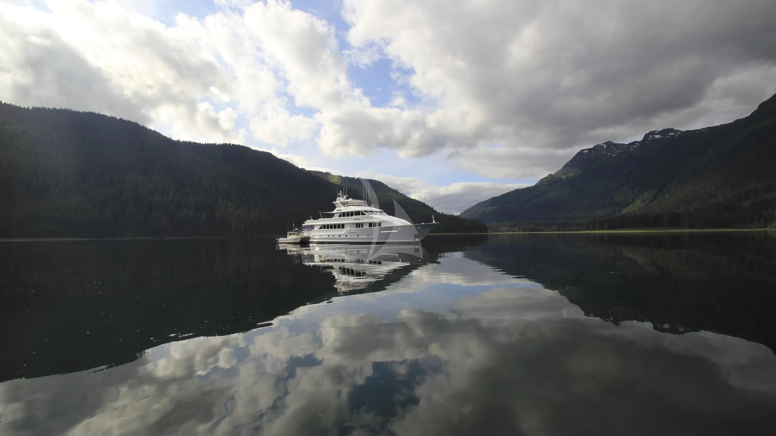 a boat on a lake aboard SERENITY Yacht for Charter