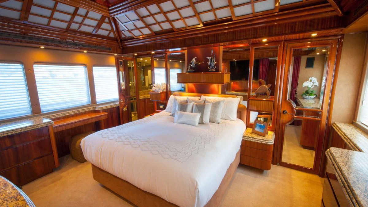 a bedroom with a bed aboard SERENITY Yacht for Charter