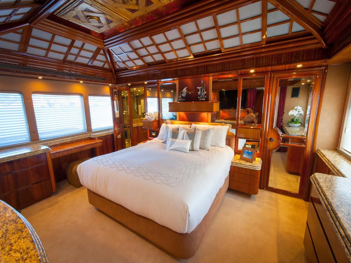 a bedroom with a bed aboard SERENITY Yacht for Charter