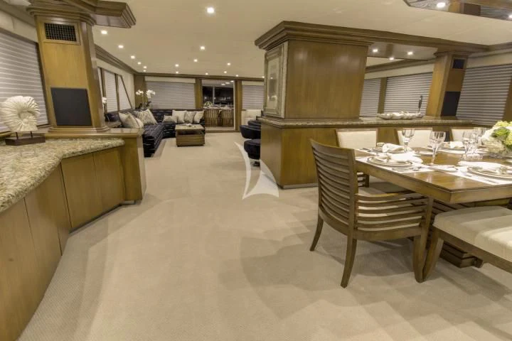 a room with a table and chairs aboard SERENITY Yacht for Charter
