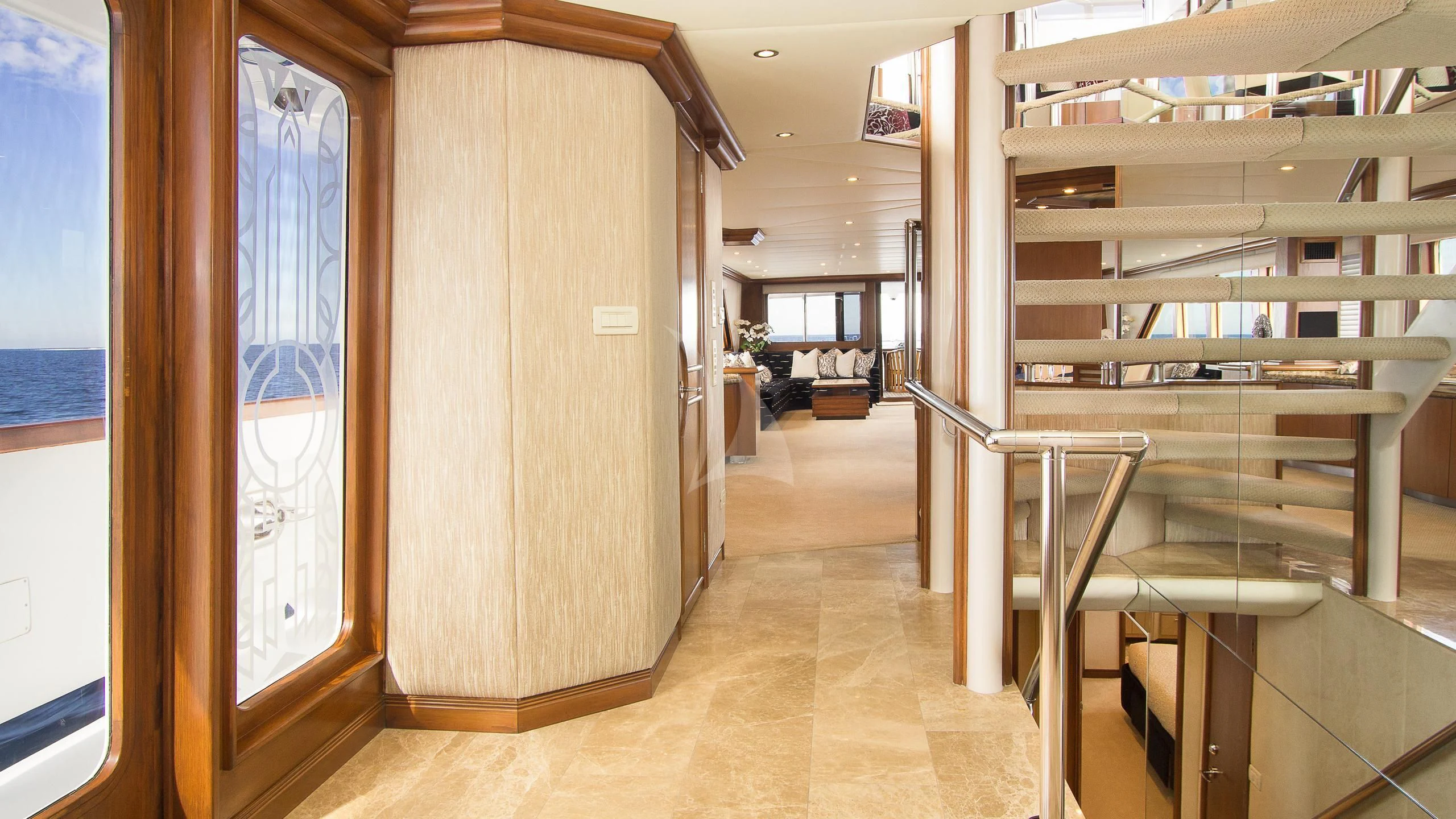 a room with wooden walls and a staircase aboard SERENITY Yacht for Charter