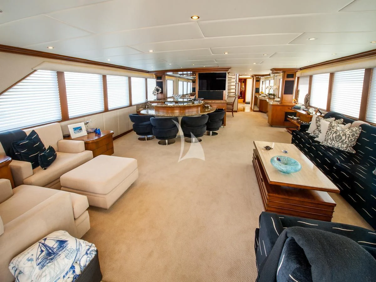a living room with a couch and a table aboard SERENITY Yacht for Charter