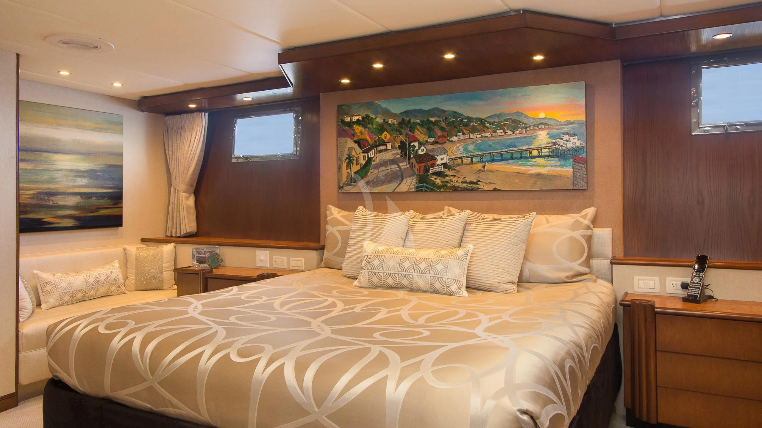 a large bed with white sheets aboard SERENITY Yacht for Charter