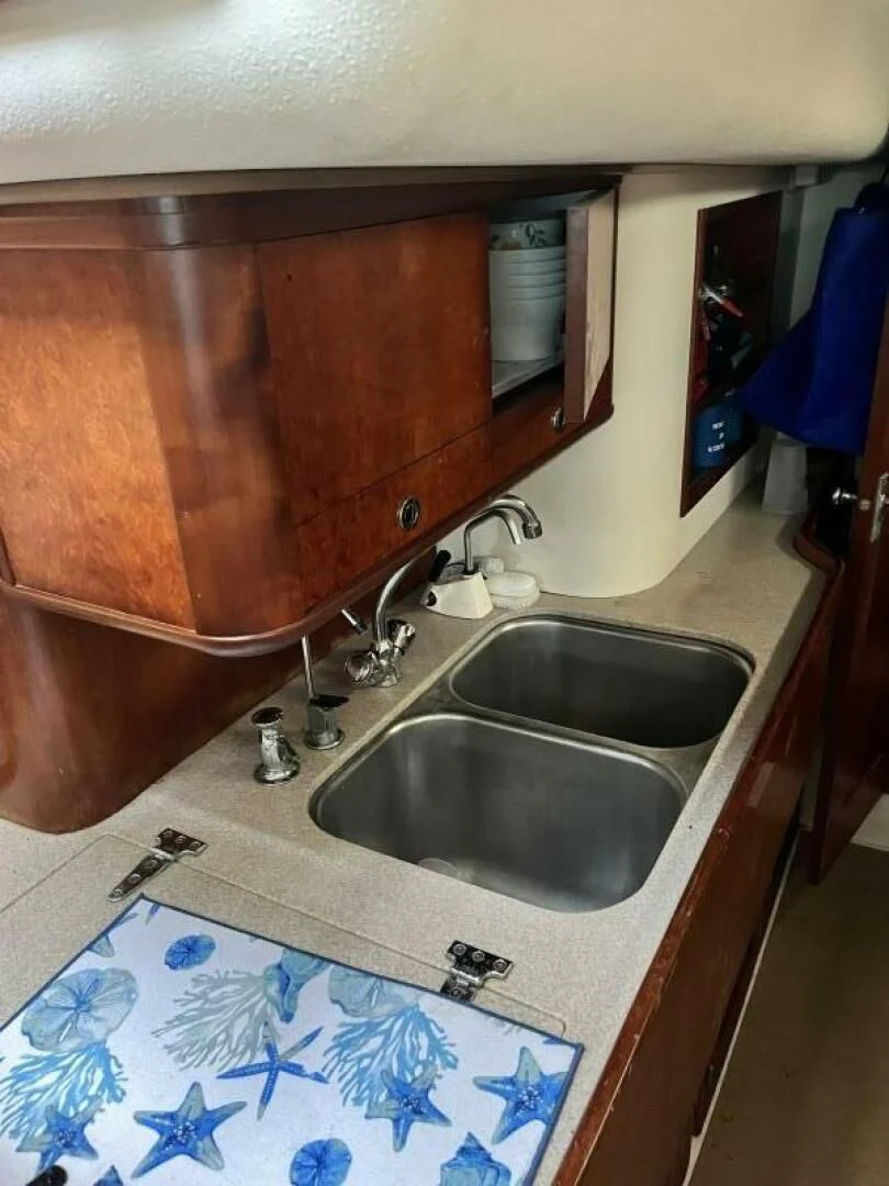 a sink with a towel on it aboard SERENITY Yacht for Charter