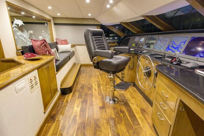 a room with a desk and a bed aboard SERENITY Yacht for Charter