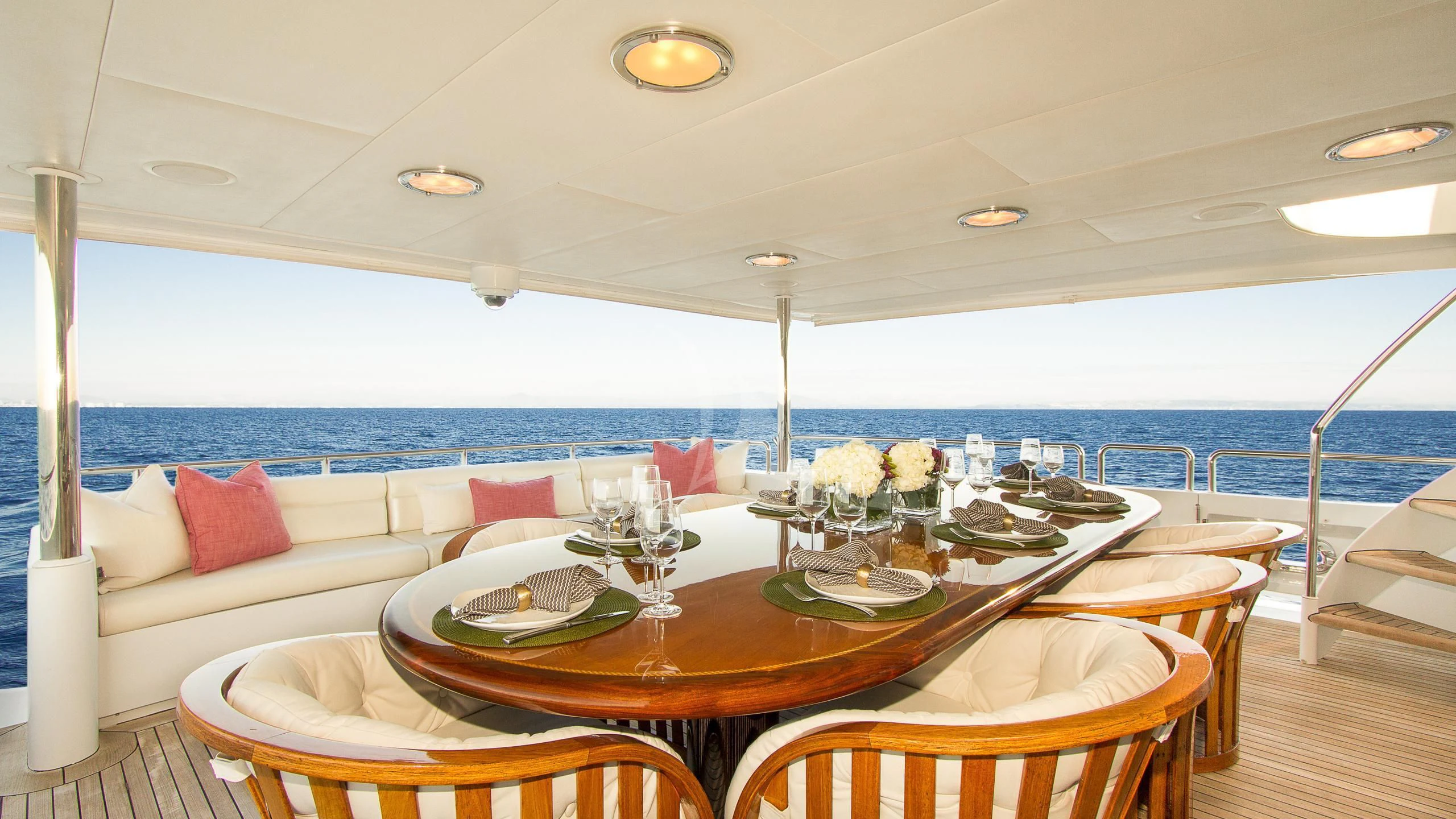 a table with plates and food on it aboard SERENITY Yacht for Charter