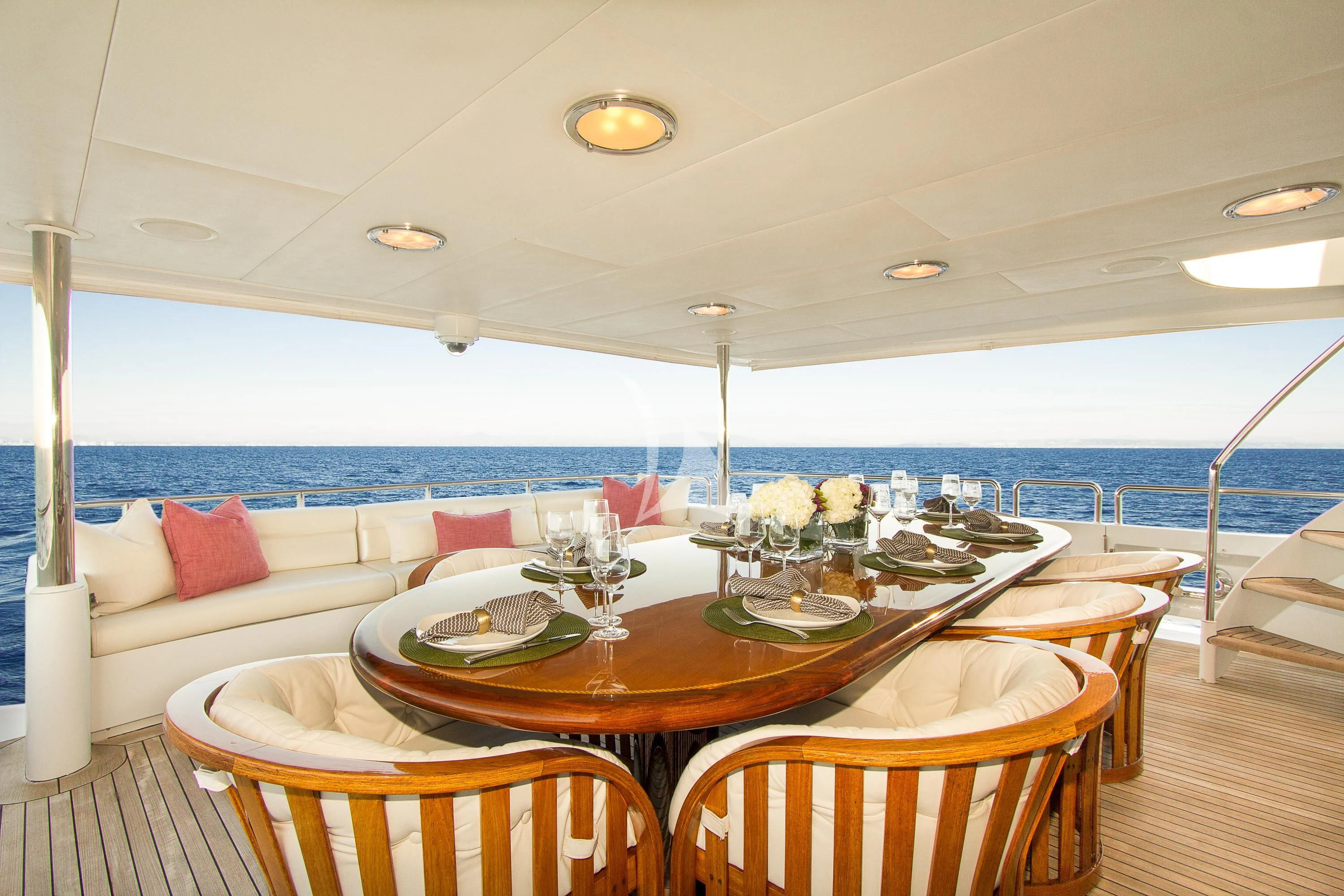 a table set for a meal on a boat aboard SERENITY Yacht for Charter
