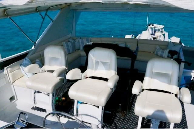 a boat with chairs and tables aboard SERENITY Yacht for Charter