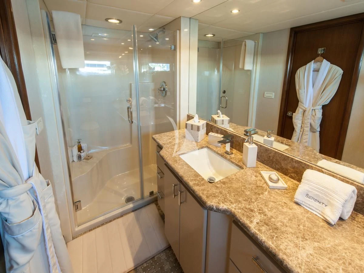 a bathroom with a large mirror aboard SERENITY Yacht for Charter