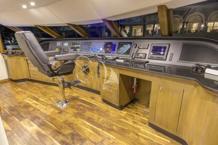 a room with a large machine aboard SERENITY Yacht for Charter