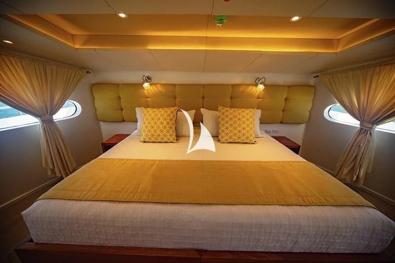 a bed with a canopy aboard GRAND DAPHNE Yacht for Charter