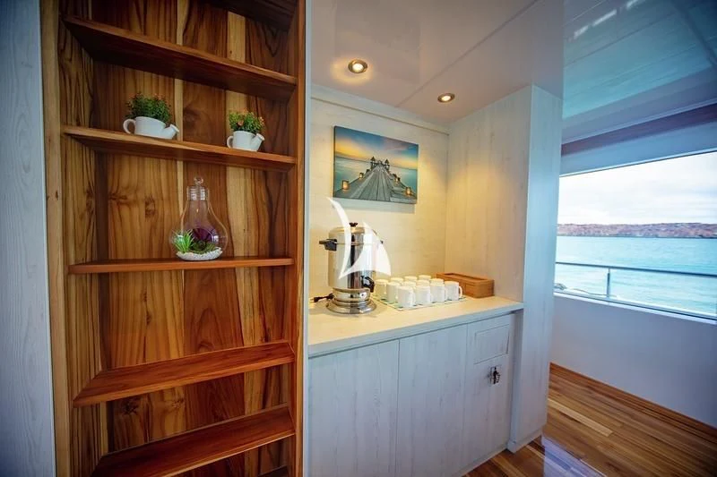 a kitchen with a shelf and a window aboard GRAND DAPHNE Yacht for Charter