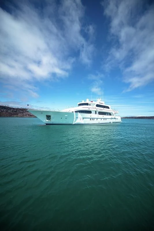 a white boat in the water aboard GRAND DAPHNE Yacht for Charter